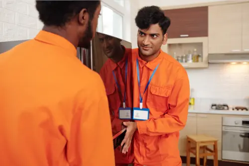 Movers-Carrying-Fridge-moving-fridge